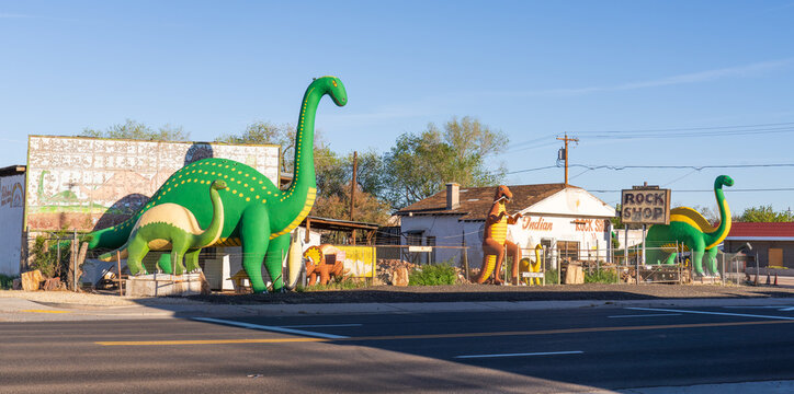 Holbrook, Arizona, USA - April 5th 2026: Dinos of Holbrook museum and shop, with large dinosaurs on the road side