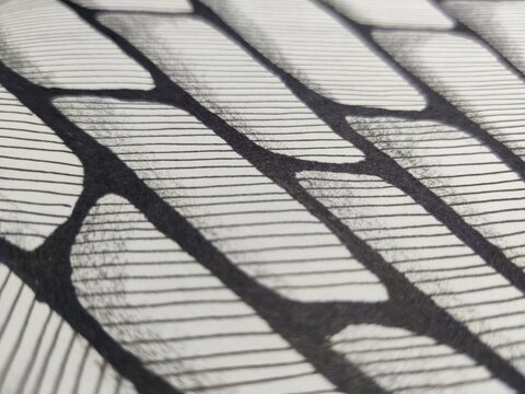 macro drawing with black marker on white background, bricks in perspective with parallel hatching, depth effect
