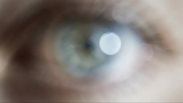 Extreme close up of a blue eye, symbolizing vision problems and blurred perception, medical health concept