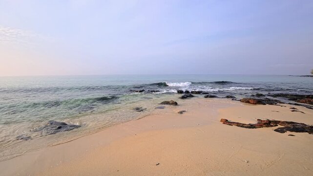 Rocky shoreline with clear shallows and gentle sea movement