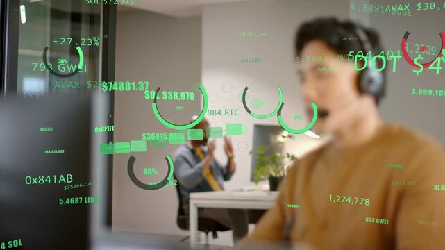 Camera pulling focus onto foreground man monitoring crypto tickers overlaying, on mic to trade