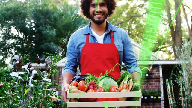 Gardener holding produce crate, looking up and smiling as green charts rising showing nursery yield
