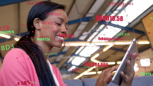 Seated woman tapping tablet causing AR crypto ticks over tablet, hexIDs, USD updating assets