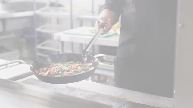 Chef grabbing handle and flipping veggies over kitchen range animated lines showing sear to plate