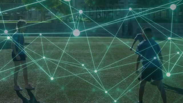 Player tapping soccer ball and trio practicing passing while network overlay tracking ball and team