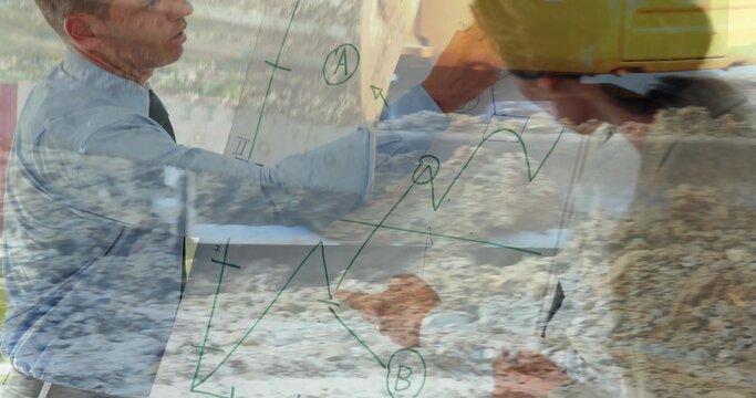 Pointing left blue shirt tie, gesturing right engineer yellow hard hat at glass board, green graphs