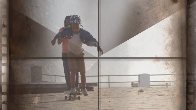 Child pushing off skateboard on pier helmet adult supervising learning balance film overlays sports