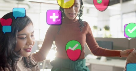 Fototapeta premium Leaning woman in rust sweater, green trousers speaking at modern office with monitor icons