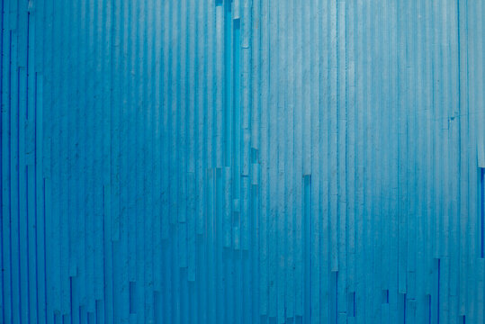 Abstract Blue Corrugated Surface Texture with Vertical Line Patterns
