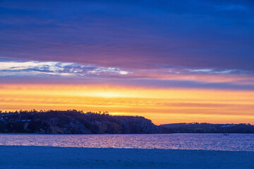 Fototapeta premium Sunrise at the rocky coastline in the french Bretagne