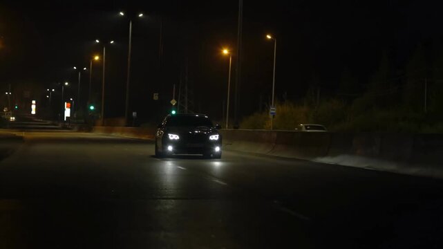 Slow Car Driving on Dark Road at Night with Street Lights Cinematic Scene