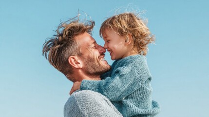 Fototapeta premium Father and son sharing a tender moment with noses touching and smiling outdoors