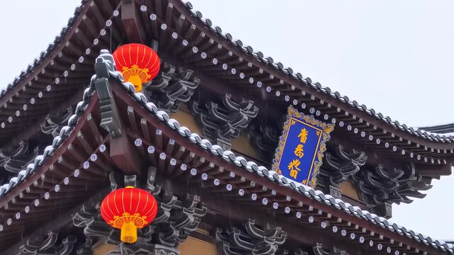 Traditional Chinese temple roof with lanterns