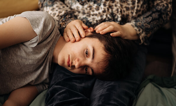 Teenage boy receiving emotional support from grandmother