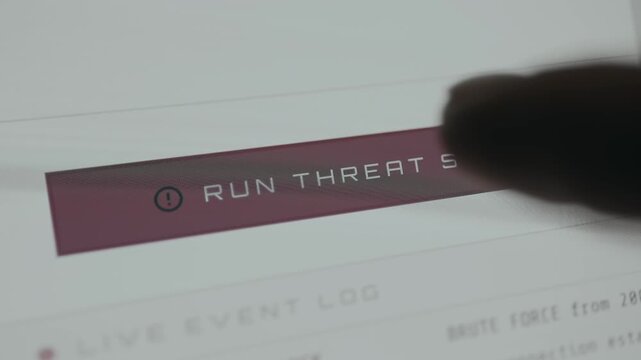 Finger taps the RUN THREAT SCAN digital button