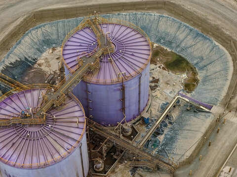 Two enormous sulfuric acid storage tanks for the mining industry