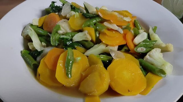 Fresh Indonesian Stir Fried Mixed Vegetables Capcay Served on White Plate