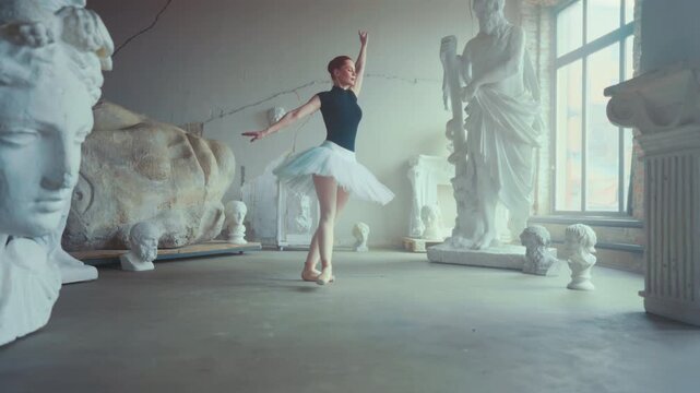 Visual aesthetics, beautiful ballerina dancing alone in light hall with statues. Female grace and beauty, express yourself by dance, enjoy classical music and choreography, slow motion in dance class