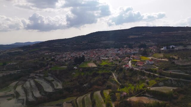 Wide Aerial Drone Approach to Omodos Village Perimeter from Northern Mountains in Cyprus