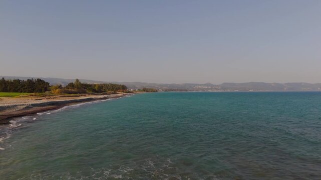 Low Drone Flight from Mavralis Shingle Beach to Mediterranean Sea Paphos Cyprus