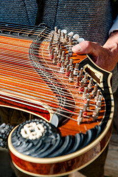 Traditional wooden zither instrument outdoors in the Austrian Alps