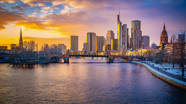 Frankfurt am Main city skyline at sunset over the river Main