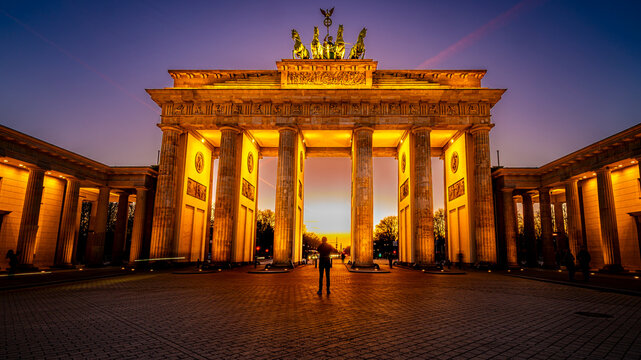 Brandenburg Gate illuminated in Berlin at sunset