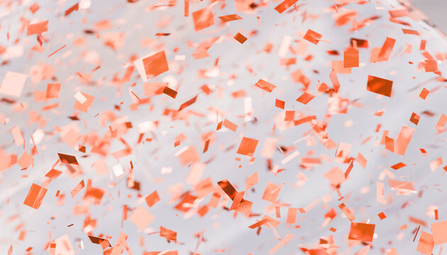 Orange confetti floating inside a clear balloon