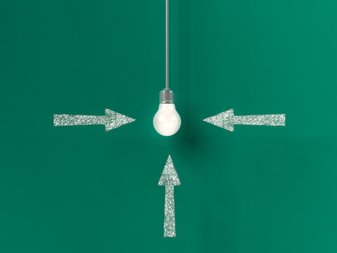 Three arrows pointing at a glowing light bulb on green background