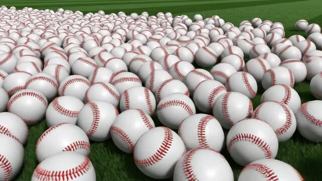 Large group of baseballs scattered across a field with green grass, representing sports and recreation