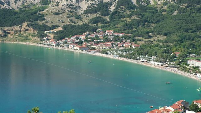 Scenic Coastal Landscape with Mountains and Town