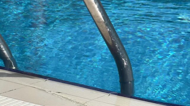 Metal pool ladder made of corrosion-resistant stainless steel (AISI-304 or AISI-316), featuring 2-5 anti-slip steps, handrails, and secure mountings for easy, safe pool access.