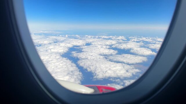 Textured Cloud Panorama Below Through Airplane Window With Wingtip, Patchwork Cloud Formations, Crisp Horizon, Highaltitude Clarity, Contemplative Atmosphere, Aerial Travel Perspective.