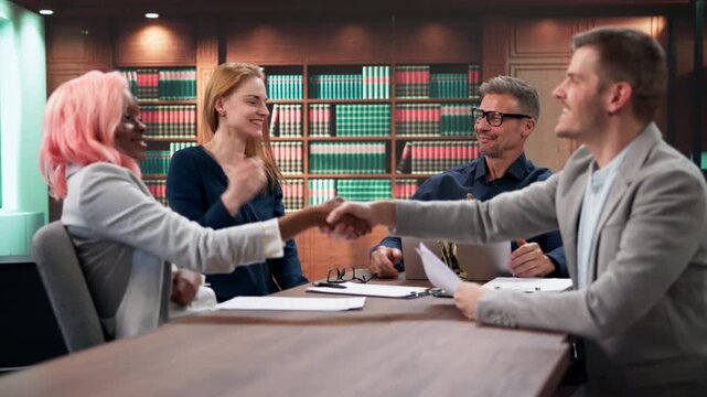 Corporate Lawyer Team Shaking Hands During Meeting