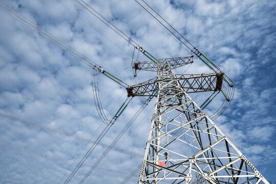 Steel Lattice High-Voltage Transmission Tower with Insulators and Overhead Power Lines