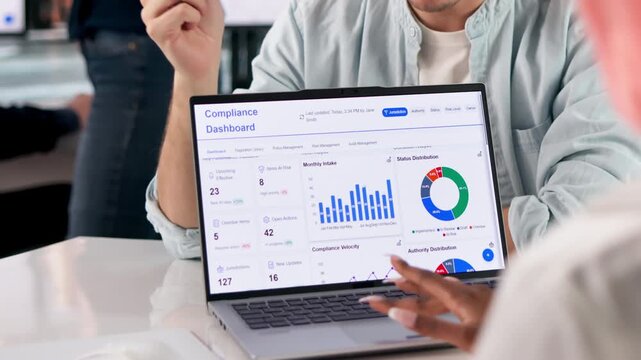 Compliance Officer Reviews Dashboard Data