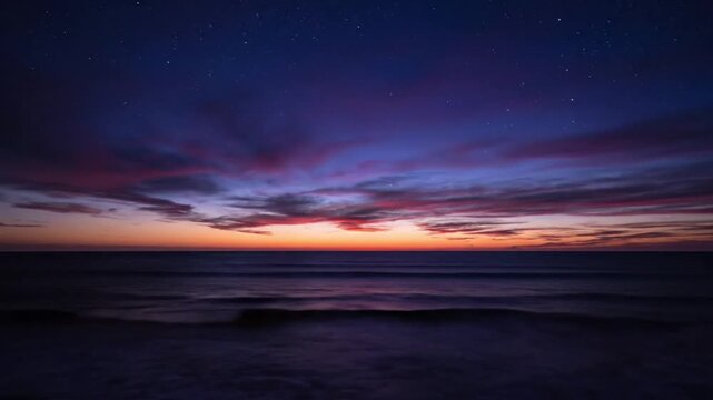 Serene ocean sunset with starry night sky and vibrant clouds