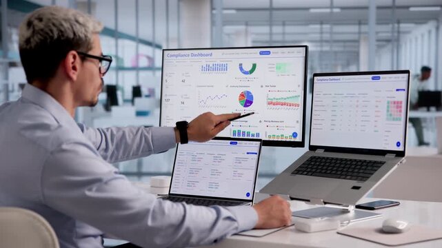Data Privacy Officer Carefully Reviews Compliance Dashboard Ensuring Security