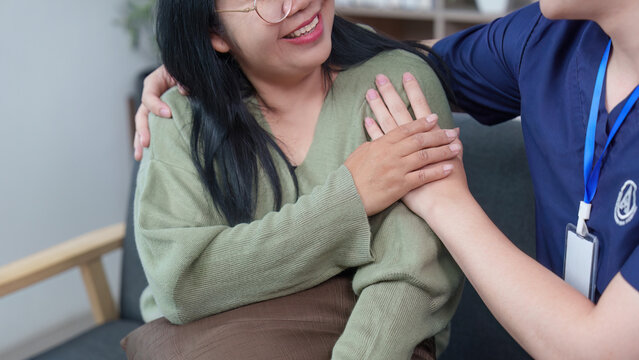 Asian healthcare professional comforting woman patient with empathy