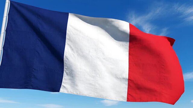 French Tricolor Flag Waving Gracefully Against a Clear Blue Sky.