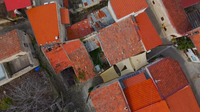 Aerial Bird's Eye View of Traditional Stone Houses and Cobbled Alleys in Lofou Village Cyprus