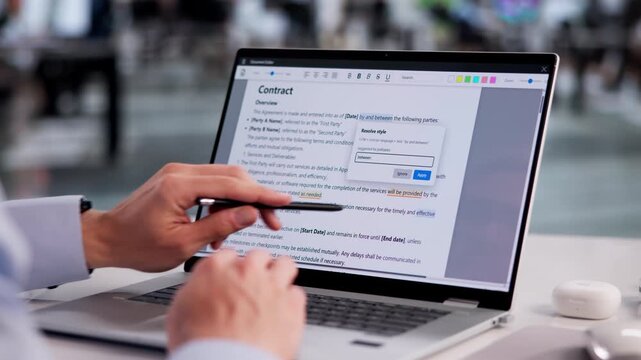 Proofreader Carefully Reviews Laptop Document
