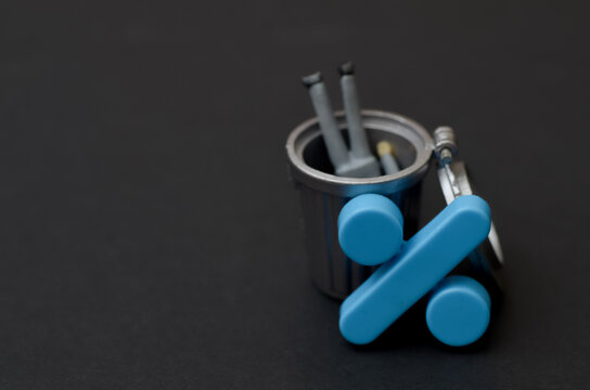 Percentage Sign in Waste Bin for Economic Loss Concept