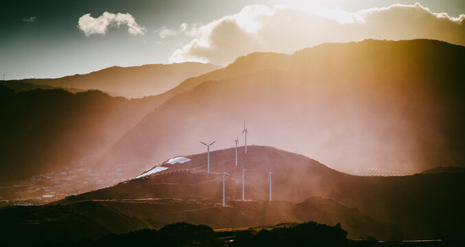 windmills in a dramatic landscape green enery