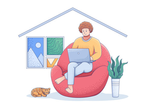 A person sits comfortably on a red bean bag chair at home and working remotely on his laptop.This depicts a freelance illustrator, programmer, writer working remotely.