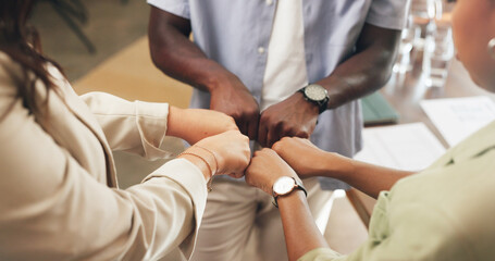 Obraz premium Hands, business and people with fist bump in office for good news, real estate success and celebration. Huddle, gesture and staff achievement for property deal, team motivation and auction milestone
