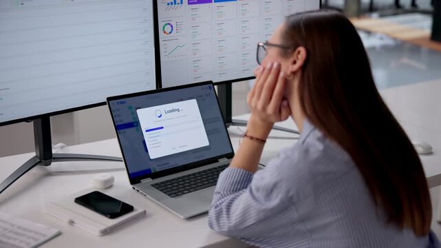 Tired Employee Waiting For Slow Loading Progress Bar To Fill While Working
