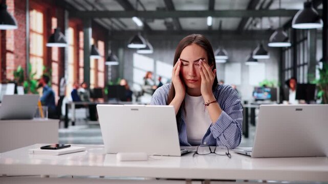 Office Manager Having Eye Strain From Prolonged Use