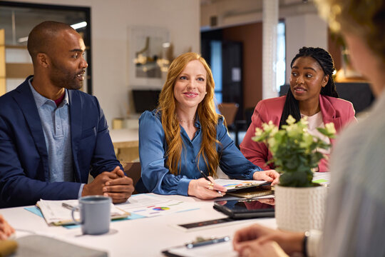 Multiethnic business team in meeting at modern board room