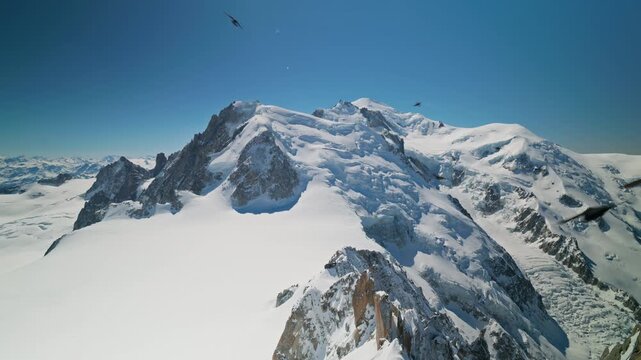A breathtaking high-altitude view of the Mont Blanc massif revealing sweeping glaciers, dramatic rocky ridges, and pristine snowfields stretching across the roof of Europe in the French Alps.